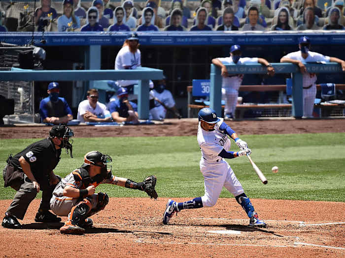 Mookie Betts swings at a pitch
